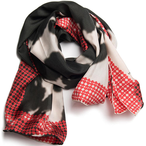 Scarf on white background, red black and white splotchy pattern 