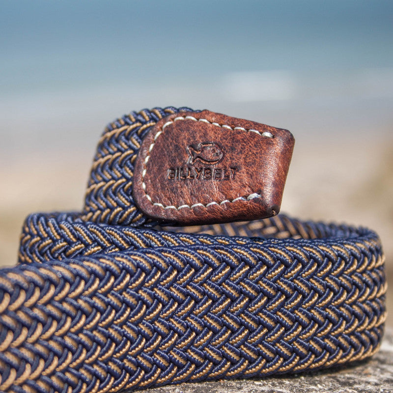 Closeup detail of woven belt on a rock at the beach
