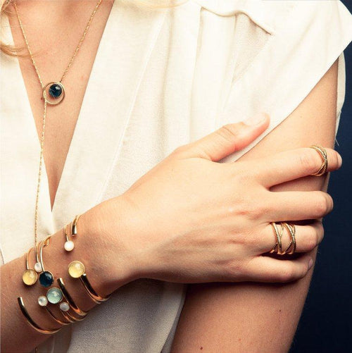 Eva Krystal bracelets, necklace and rings in gold with precious stones