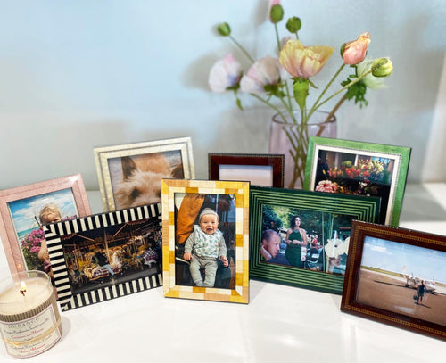 Designer photoframe with beige leather backing shell grey frame