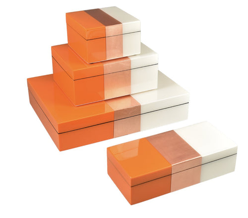 Five orange copper and cream lacquer boxes stacked designer homeware