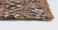 Closeup of edge of rug and woven detail.