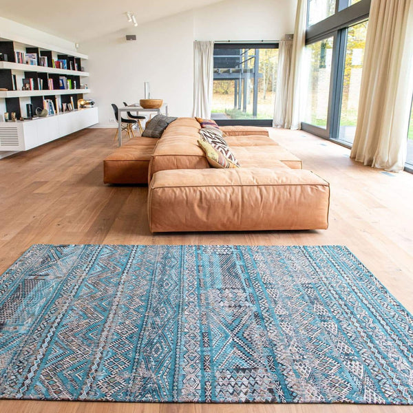 Livingroom view of rug with Morrocan nomad pattern in blue tones.