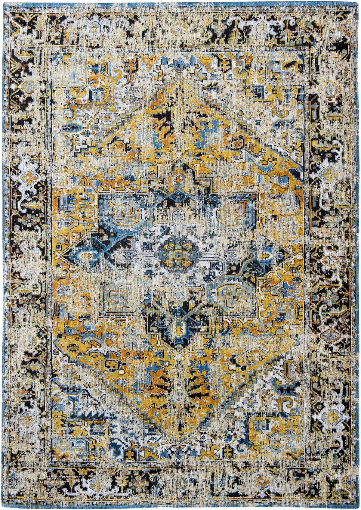 full view of faded rug in blue and earth tones 