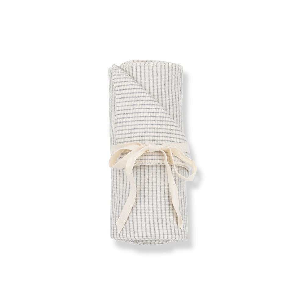 Grey and white striped blanket tied up with white ribbon