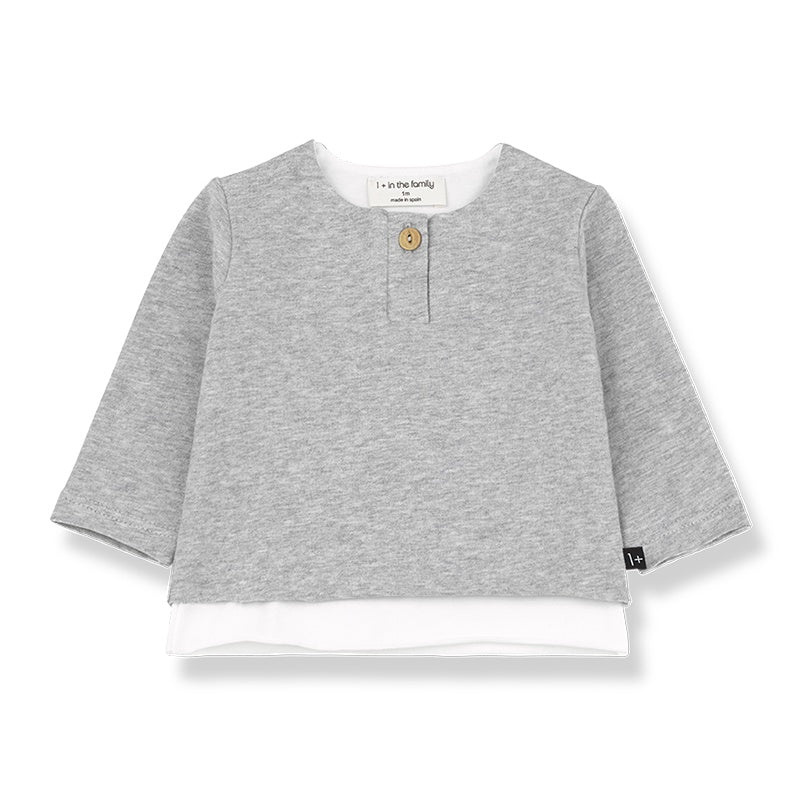 Grey long sleeve top for baby with white at the bottom