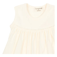 Closeup material view of organic cotton on white baby dress